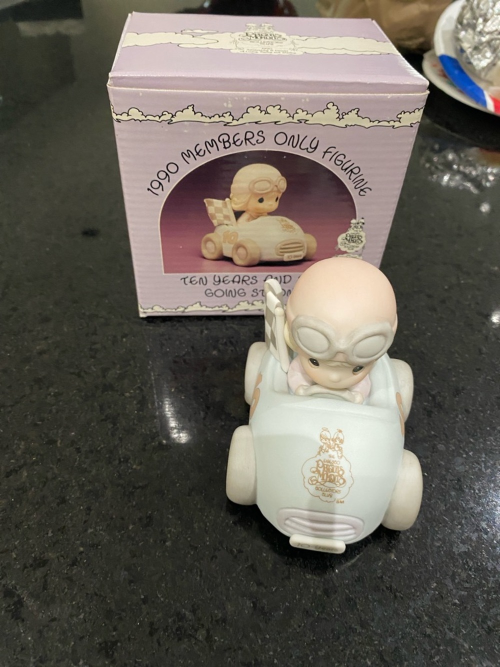 Precious Moments Pastel Blue Racing Car with Checkered Flag
Members only 1990